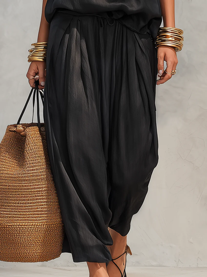 Ensemble top sans manches dos nu noir et pantalon plissé