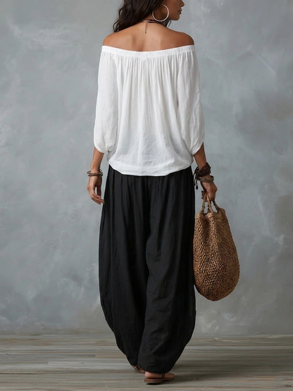 Ensemble top épaules dénudées et pantalon lanterne ample blanc